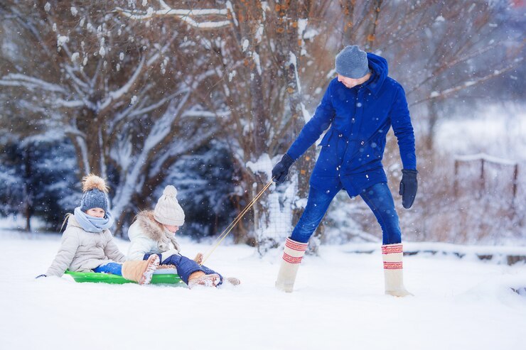little-girls-enjoy-sleigh-ride-father-sledding-his-little-adorable-daughters_109800-7328.jpg