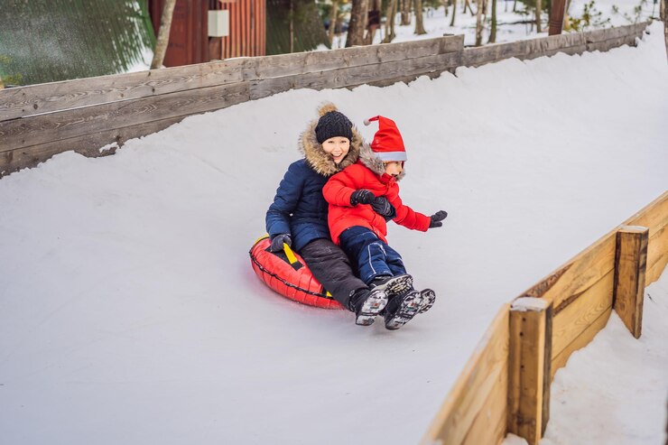 mom-son-ride-inflatable-winter-sled-tubing-winter-fun-whole-family_247622-31096.jpg