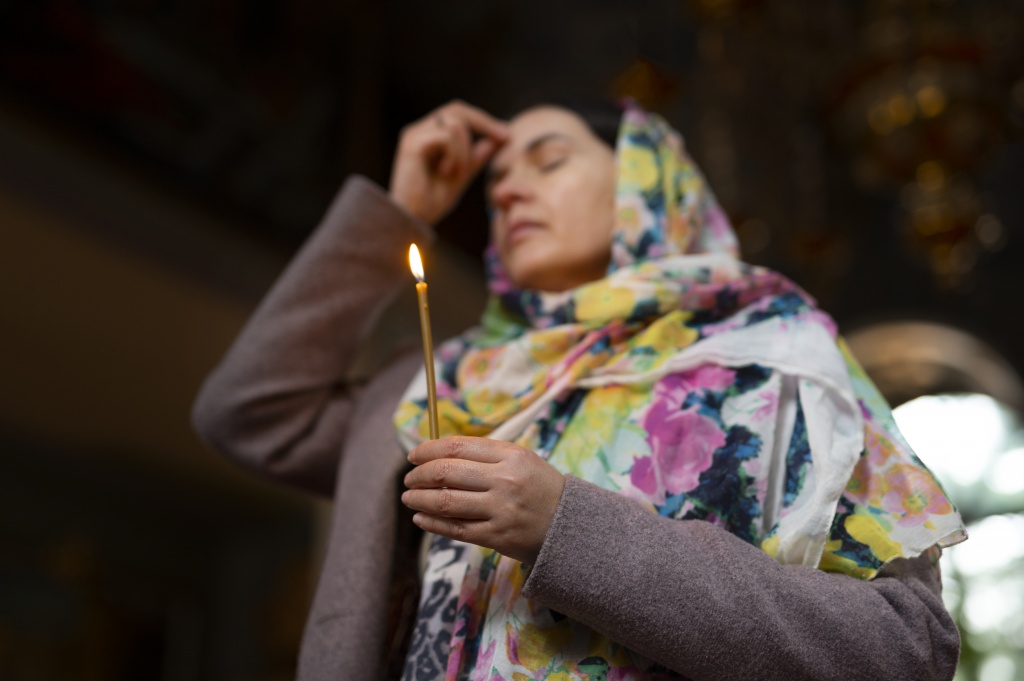 woman-praying-in-church-for-religious-pilgrimage.jpg